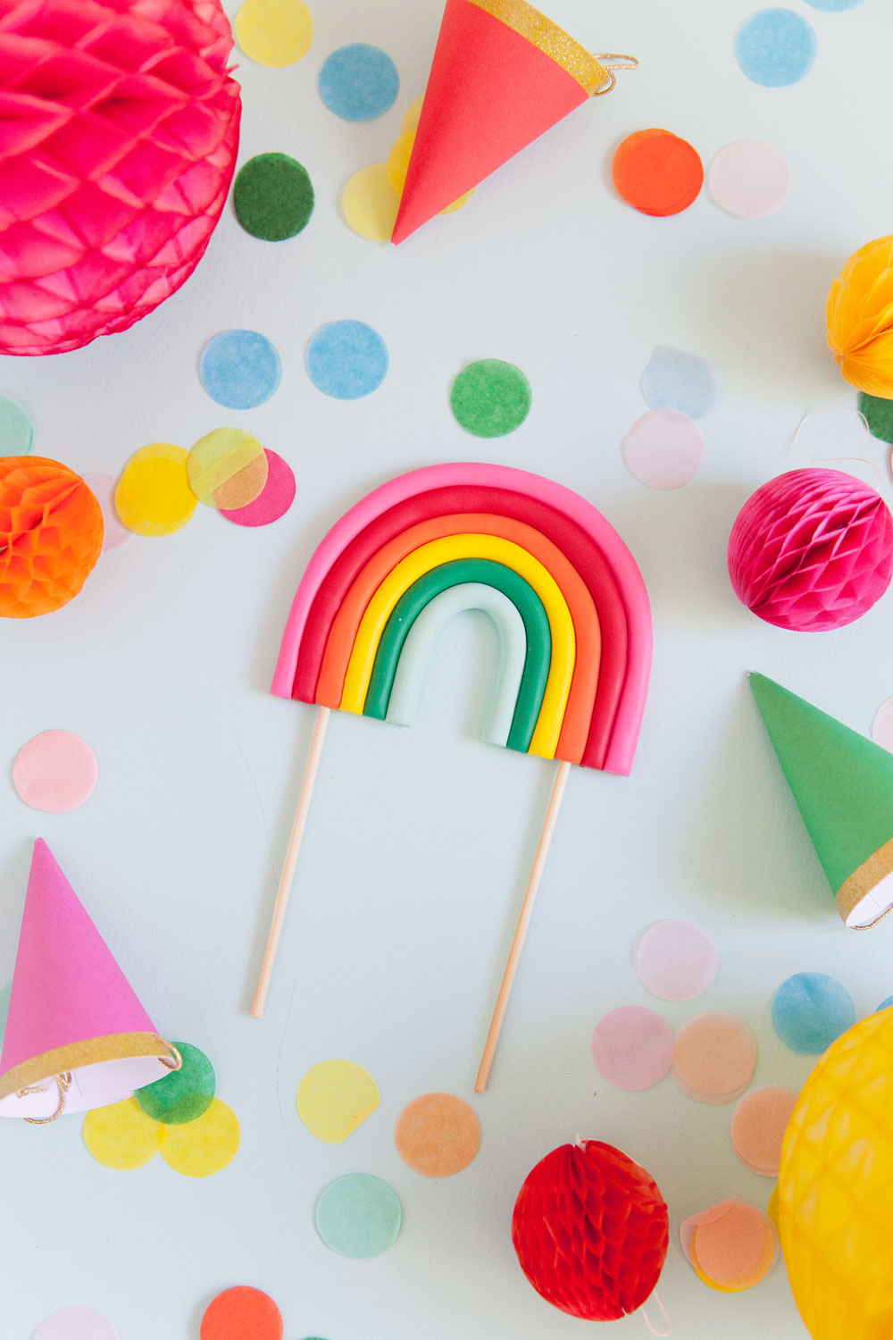 Make this cute DIY rainbow cake topper in a few simple steps. Perfect for any rainbow or unicorn themed birthday parties