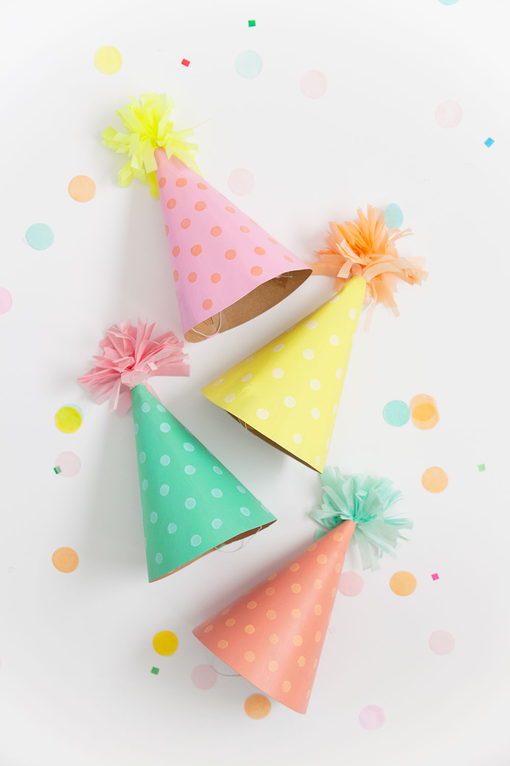 DIY party hats! Learn how to make these adorable pastel party hats which are sure to be a hit!