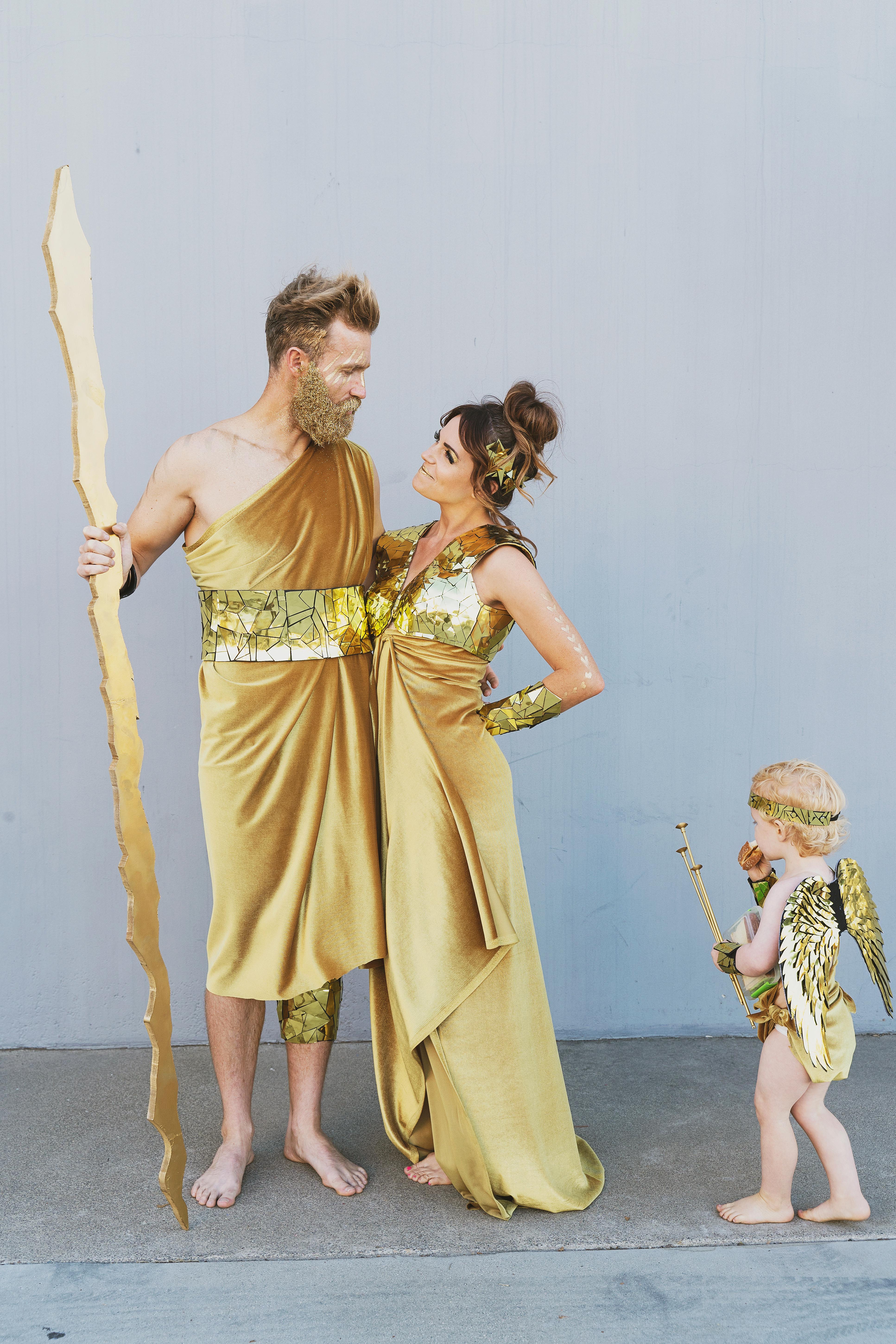 Learn how to make these amazing DIY Greek God Family costumes. They are sure to be a hit this Halloween time. Zeus, Hera, Apollo, Aries, Cupid.