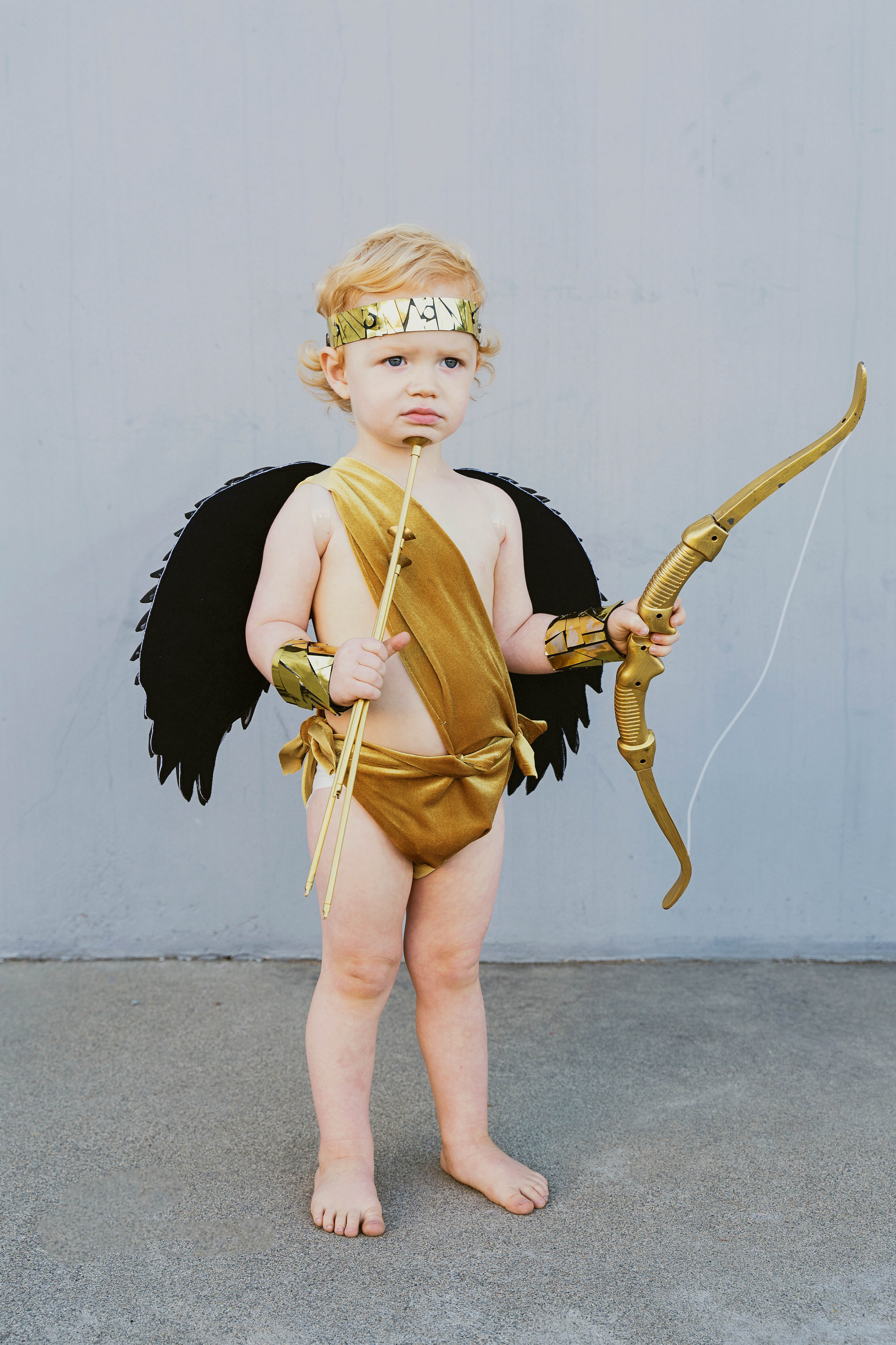 Learn how to make these amazing DIY Greek God Family costumes. They are sure to be a hit this Halloween time. Zeus, Hera, Apollo, Aries, Cupid.